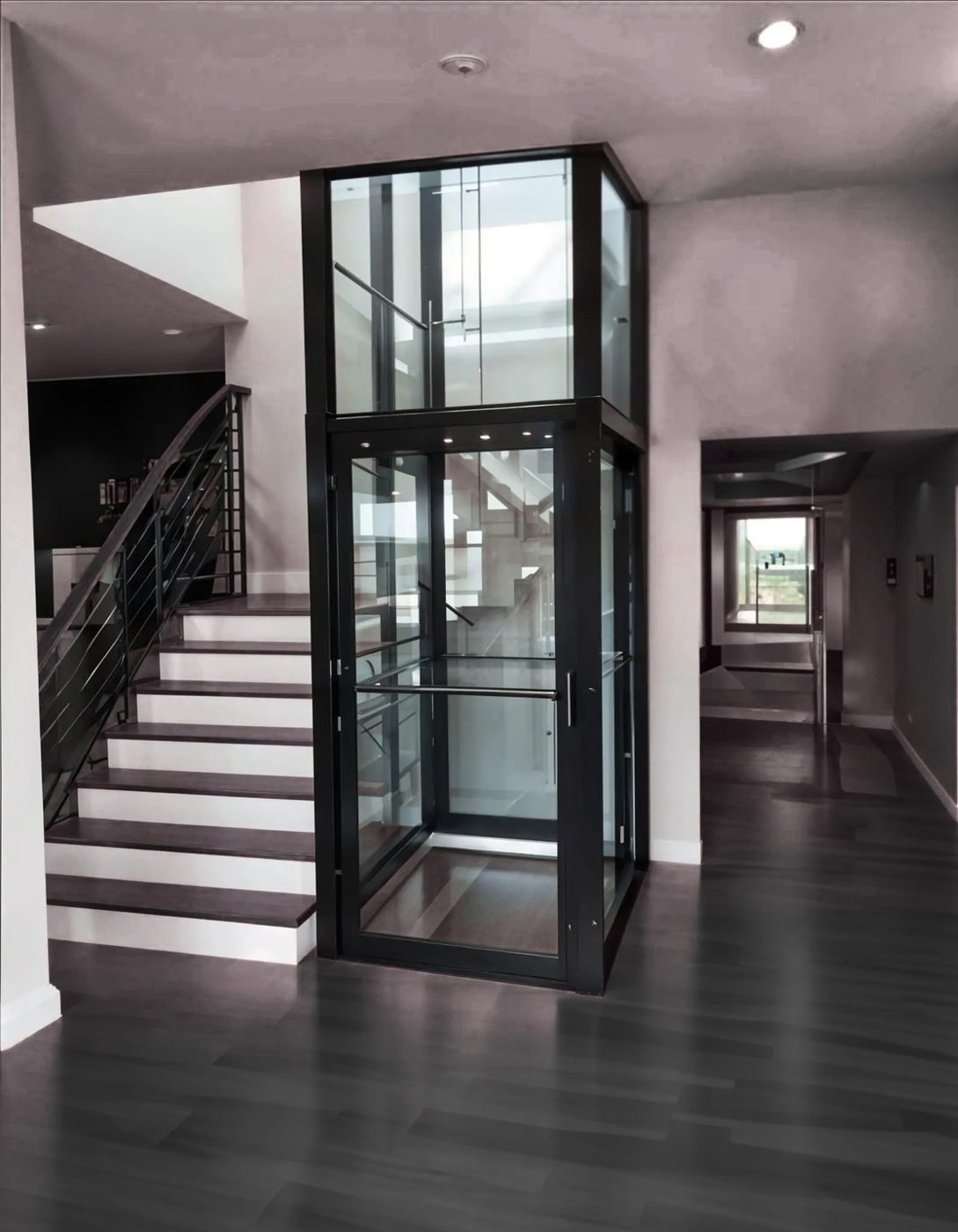 NeoRide glass home elevator installed beside a staircase